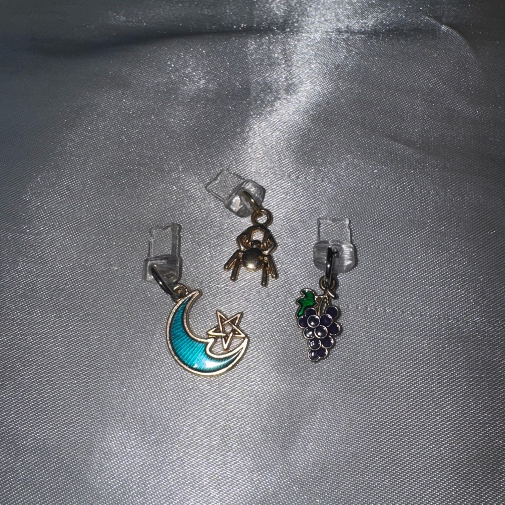 I phone dust plug charm set